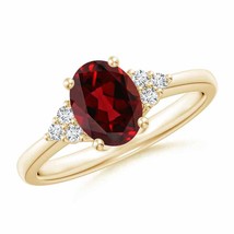 ANGARA Solitaire Oval Garnet Ring with Trio Diamond Accents in 14K Gold - £862.27 GBP