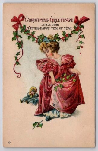 Primary image for Christmas Greetings Adorable Victorian Child In Red With Her Doll Postcard C39