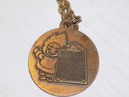 Vintage Eskimo Radiator 1918-1978 Metal Embossed Pendant and chain - $553.60 MXN