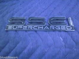 2001 PONTIAC BONNEVILLE SIDE SSE BLUE EMBLEM GOLD OEM USED CHIPPED - $939.88 MXN