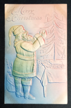 A Merry Christmas Santa Decorating Xmas Tree Airbrushed Embossed Postcard c1908 - £7.90 GBP