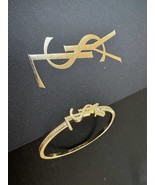 Saint Laurent Paris YSL Gold Tone Rhinestones Inlaid Logo Skinny Bangle - $4,693.92 MXN
