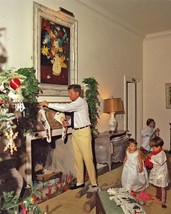 President John F. Kennedy hangs Christmas stockings on mantel New 8x10 Photo - £6.88 GBP
