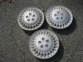 Genuine 1985 to 1989 Pontiac Grand AM 13 inch hubcaps wheel covers white - £21.35 GBP