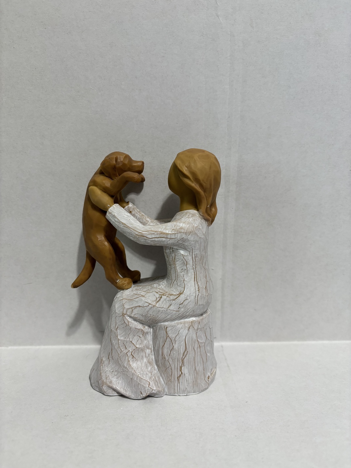 Woman Holding Dog Out - $25.00