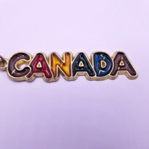 Canada Bubble Keychain Rainbow Bright Colors Metal 1980s - $12.30