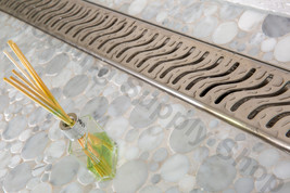 Royal Linear Shower Drain Ocean Wave 47 Stainless Steel by Serene Steam - $7,214.82 MXN