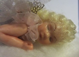 Vintage miniature  hand crafted angel dolls laying on a cloud - $95.00