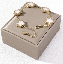 Gold chain bracelet with white flower charms and cubic zirconia crystals - £14.64 GBP