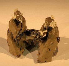 Ceramic Figurine Two Mud Men Sitting On A Bench Reading Books - 2.5&quot;  - $7.95
