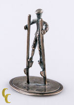 Miniature Vintage Dollhouse Silver Figurine Man Walking On Stilts - $261.91
