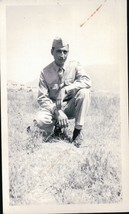Vintage Soldier Crouching In Grassy Area Snapshot WWII 1940s - $4.99