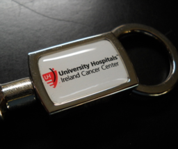University Hospitals Ireland Cancer Center Key Chain Plunger Release Metal - £6.28 GBP