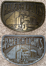 Lot of 2 Raleigh Lights Metal Belt Buckle Cigarette/Trucker 1 Brass 1 Silver - £19.66 GBP