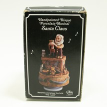 VIntage Santa Claus Workbench Spinning Musical Figure Play&#39;s &quot;TOY LAND&quot; - £11.71 GBP