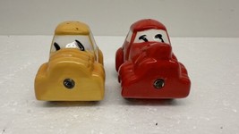 Magnetic Cars Ceramic Salt &amp; Pepper Shakers Red &amp; Yellow Car Set - $16.78