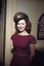 Shirley Temple happy in burgundy dress wearing military hat 18x24 Poster - $23.99
