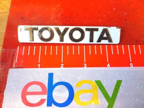 84 1988 Toyota Corolla Rear Emblem White/Chrome Original Equipment Manufacturer  - £17.61 GBP