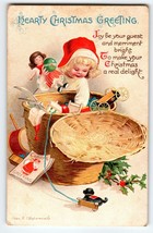 Christmas Postcard Ellen Clapsaddle Child Girl Wicker Basket Toys Embossed 1914 - £24.30 GBP