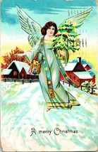 Vtg Postcard 1909 Embossed Christmas Angel Holding Christmas Tree Snow Scene M21 - $3.91