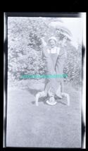 black and white negative - 2 men in overalls horsing around handstand on... - $8.95