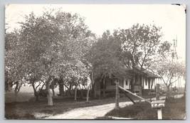 RPPC Farmhouse Windmill Yard Swing Creepy Person Dog Livestock Postcard D23 - £7.95 GBP