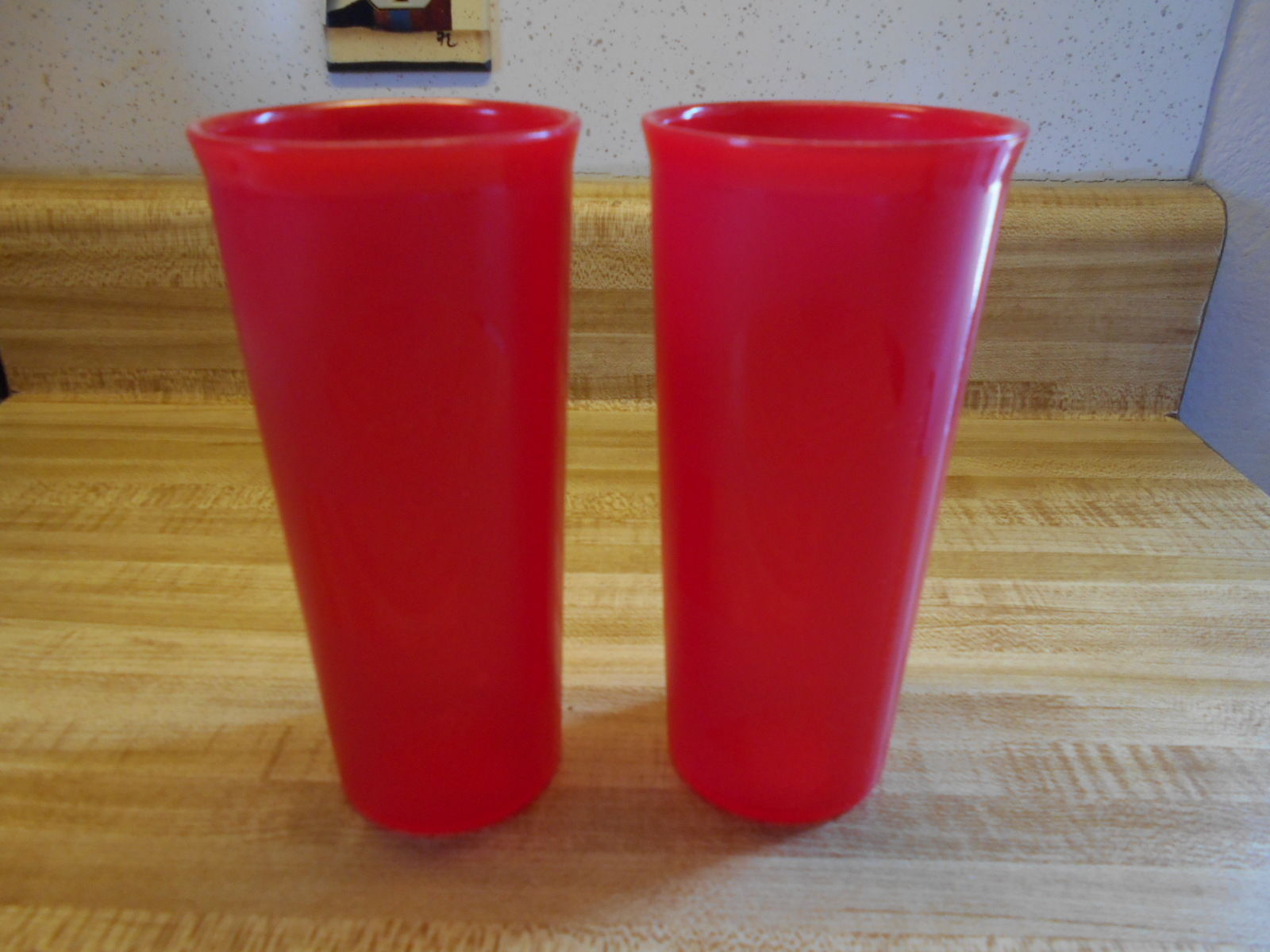 Red tupperware tumblers with geometric shapes - $14.20