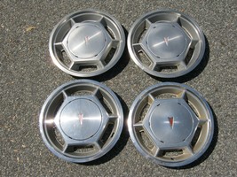 Factory original 1975 to 1980 Pontiac Sunbird Astre 13 inch hubcaps whee... - $46.40