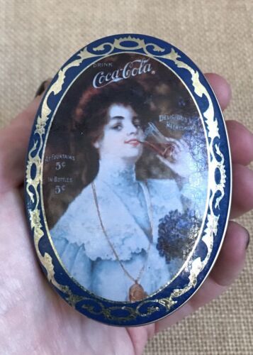 Vintage Small Oval Coca Cola Pocket Tin Renaissance Lady Drinking Soda Funny - £7.96 GBP
