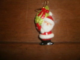Santa Holding Christmas Tree Ornament - $1.36 CAD