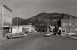 Chewelah Washington WA Postcard RPPC Main Street View ca 1960 Rexall Ell... - £13.14 GBP