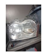 Brand New in Plastic Jeep Grand Cherokee Headlight 05-07 - $50.40