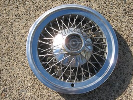 One genuine 1974 to 1979 Ford Thunderbird 15 inch wire spoke  hubcap whe... - $46.40