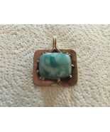 Larimar Stone Set in a Silver Pendant - $950.34 MXN