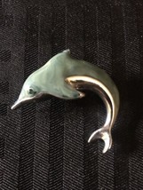 Vintage silvertone dolphin with green eye and greenish blue body brooch pin - $10.00