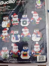 Bucilla Snowmen and Santa Set of 12 Plastic Canvas Ornaments #61217 - £34.79 GBP