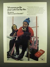 1970 Lark Cigarettes Ad - Didn't We Meet in Grenoble? - $18.49