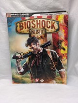 *Damaged* Bioshock Infinite Bradygames Strategy Guide Book - $274.36 MXN