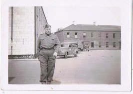 Antique Photo WW2 Era Soldier In Front Of Barracks Trucks - £2.28 GBP