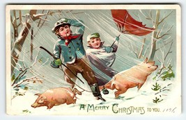 Christmas Postcard Pigs Boy Girl Blowing Wind Snow Umbrellas Tuck Series 102 - $18.90