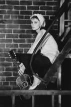 Audrey Hepburn Breakfast at Tiffany&#39;s With Guitar On Porch 18x24 Poster - $23.99