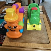 Two Fisher Price Trains - $12.20