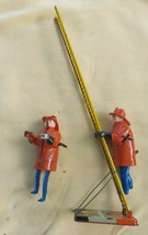 Louis Marx &amp; Co. Smokey Joe climbing firefighter - vintage wind up tin toy - $233.74
