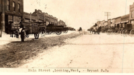 Bryant SD South Dakota Main Street View Postcard RPPC Dirt Road Horse Wagon - £34.90 GBP