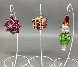 3 Ornament Lot: Radko Gift Box Ornament, Pink Snowflake Star, Smiling Child - £39.25 GBP