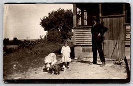 Denison Iowa RPPC Cute Girl Feeding Dogs with Father on Farm Postcard D27 - £15.11 GBP