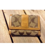 Authentic Coach brown signature vintage wallet - $888.38 MXN