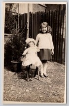 RPPC Darling Girl With Large Antique Doll in Yard c1930 Real Photo Postcard U23 - £15.94 GBP