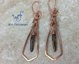Handmade copper earrings: framed wire wrapped dangling amber glass dagger bead - $29.00