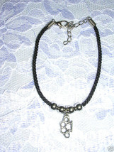 PEWTER BRASS KNUCKLES CHARM BLACK WEAVE CORD &amp; SILVER TONE ACCENT BEADS ... - $91.86 MXN